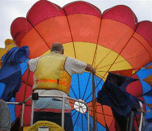 The parachute is inflated and inspected before the parasailor is attached to it